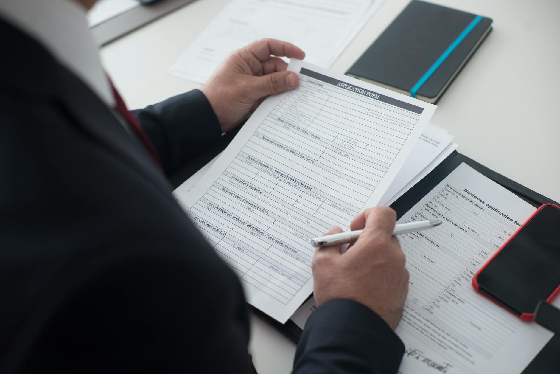 permit application paperwork desk (Photo: Kampus Production / Pexels)