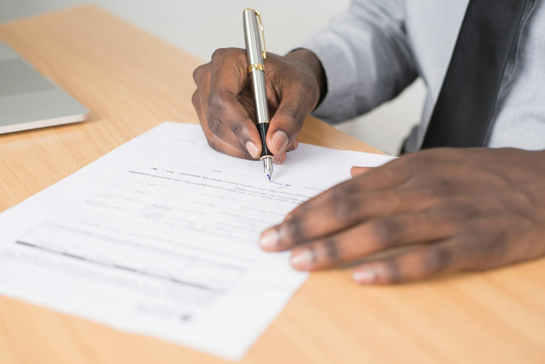 permit application paperwork desk (Photo: Cytonn Photography / Pexels)