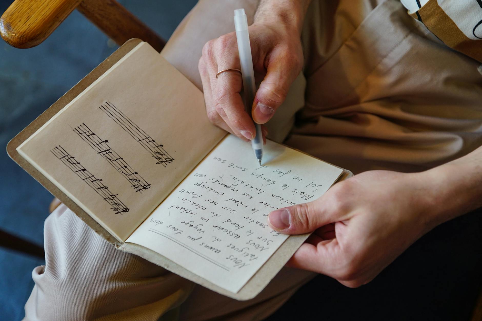 songwriter writing lyrics notebook (Photo: cottonbro studio / Pexels)
