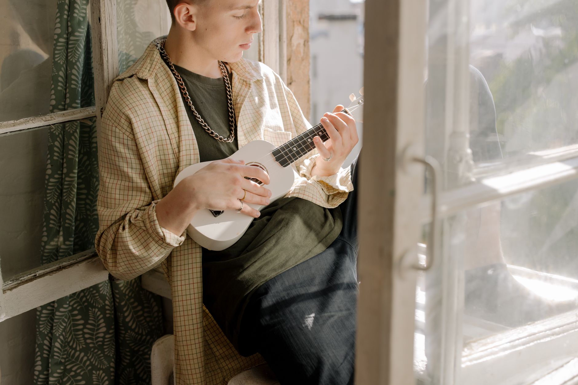 musician peaceful break window (Photo: cottonbro studio / Pexels)