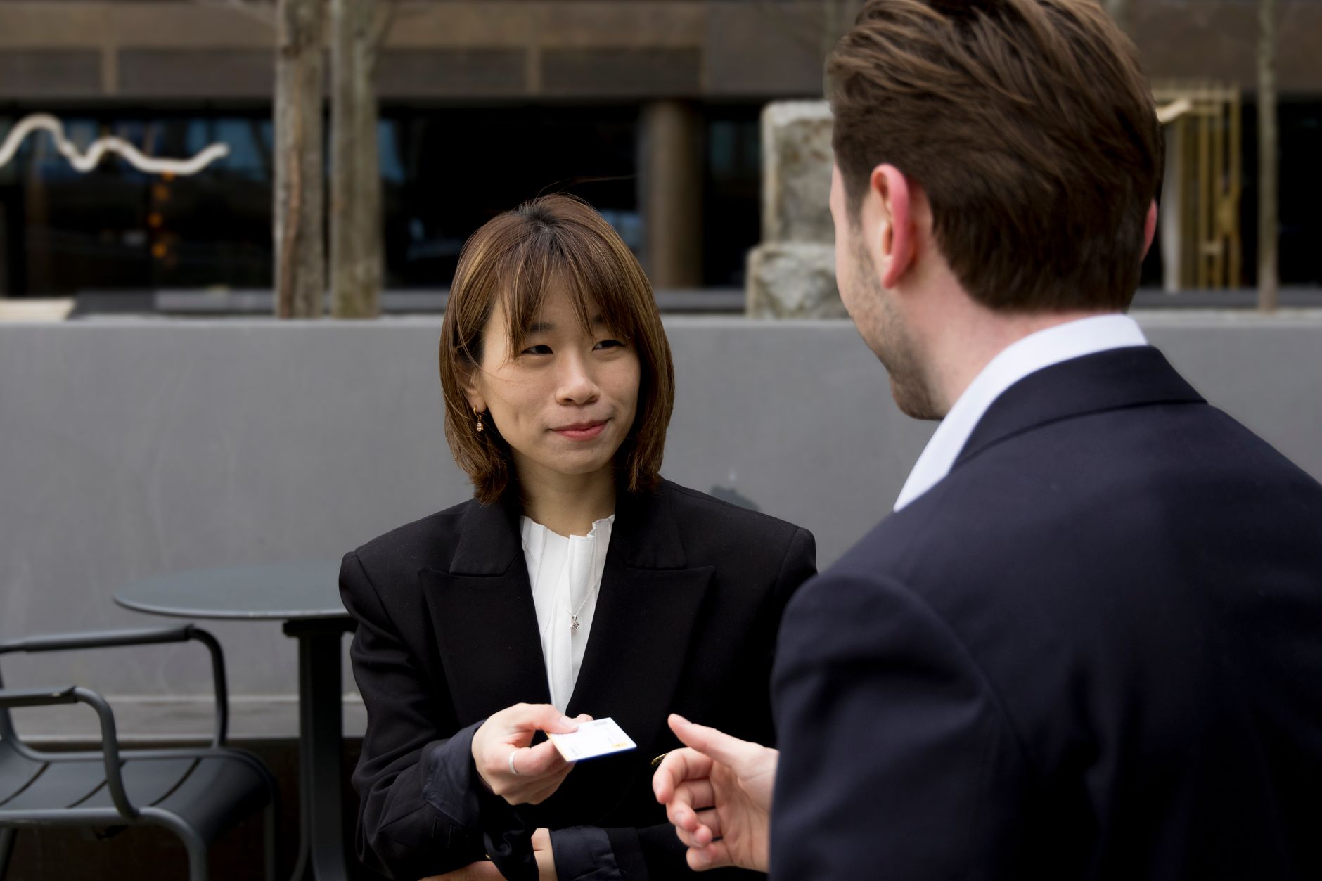 business card hand exchange (Photo: Max Medyk / Pexels)