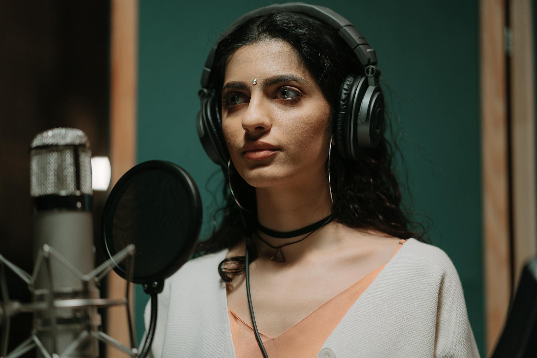 singer recording booth headphones (Photo: cottonbro studio / Pexels)