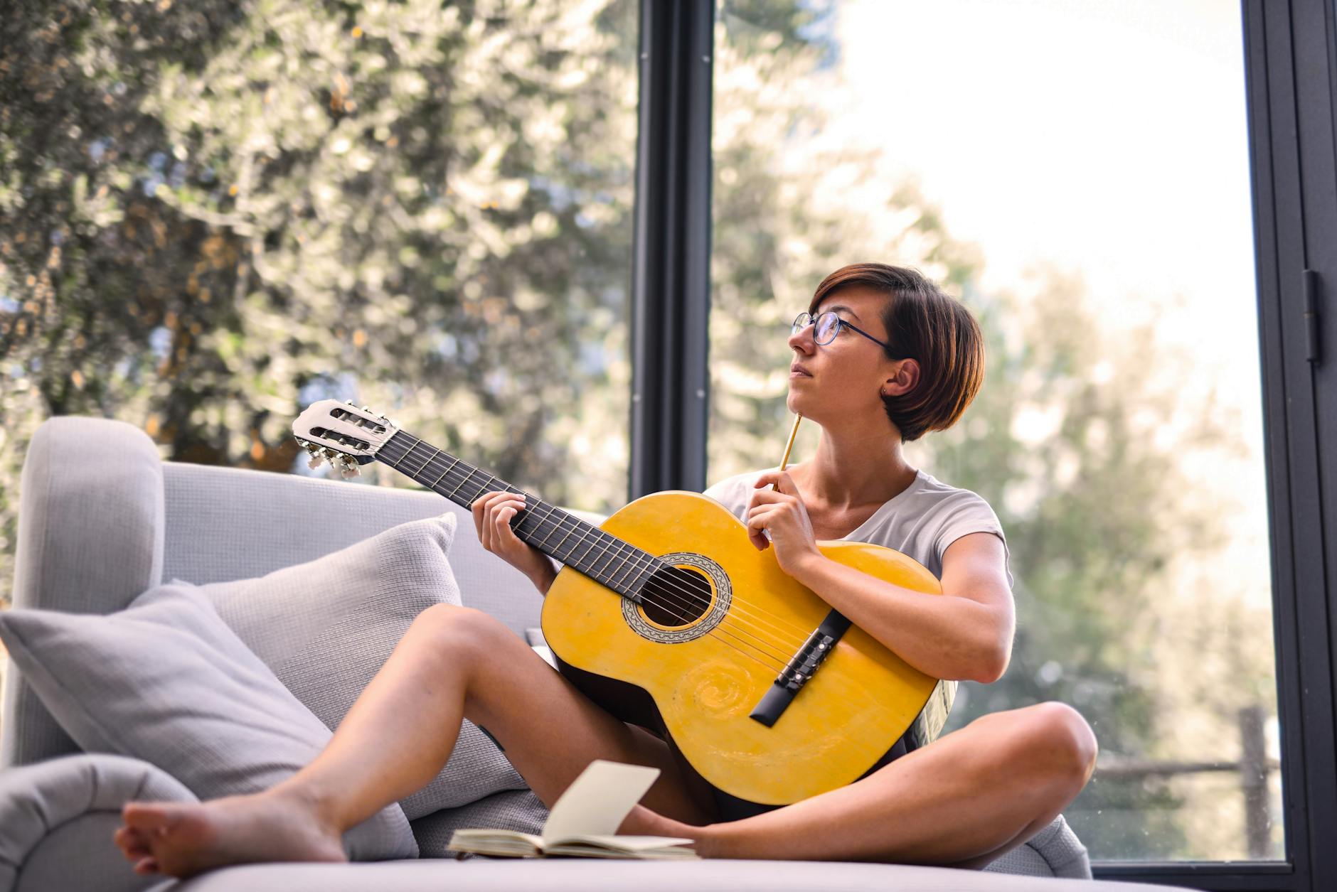 songwriter guitar lyrics paper (Photo: Andrea Piacquadio / Pexels)