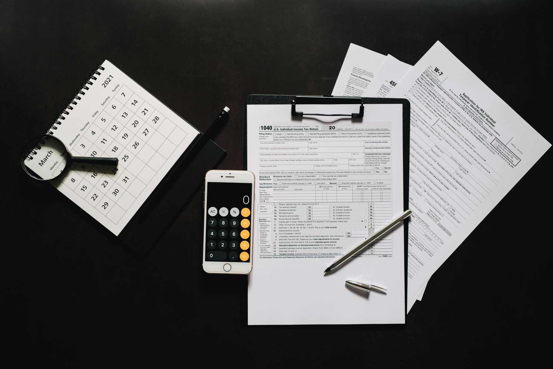 tax document calculator desk (Photo: Leeloo The First / Pexels)