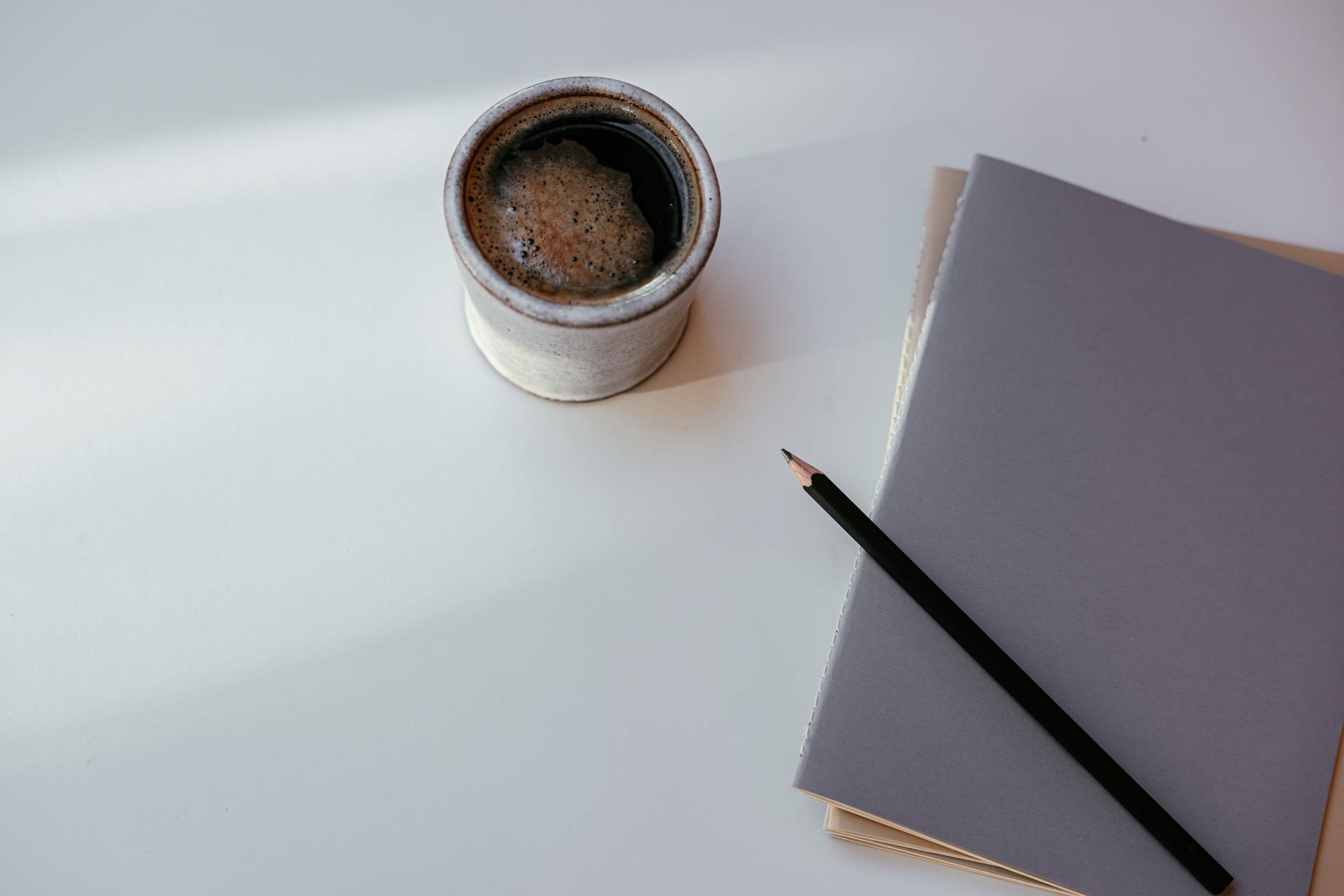 musician planning notebook coffee (Photo: Cup of Couple / Pexels)