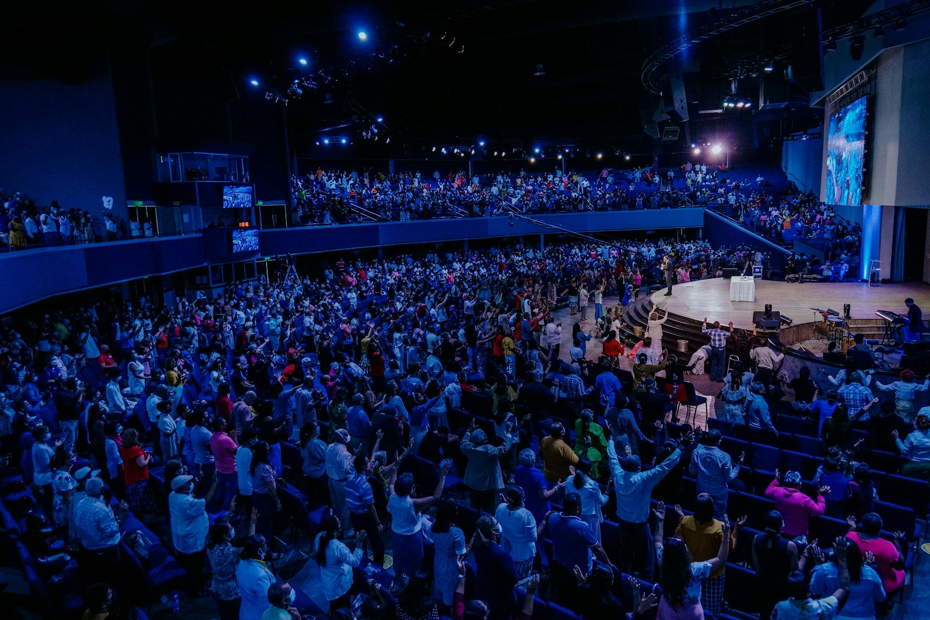 live venue full audience hands (Photo: Luis Quintero / Pexels)