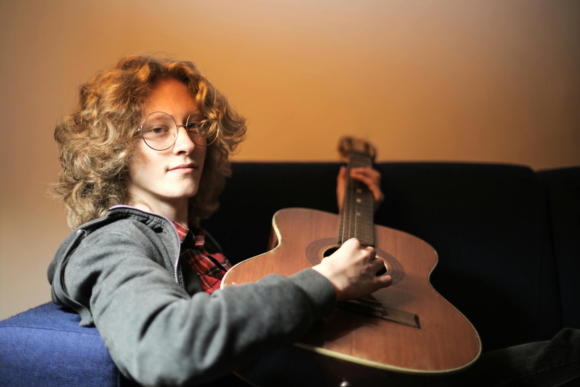 musician acoustic guitar warm light (Photo: Andrea Piacquadio / Pexels)