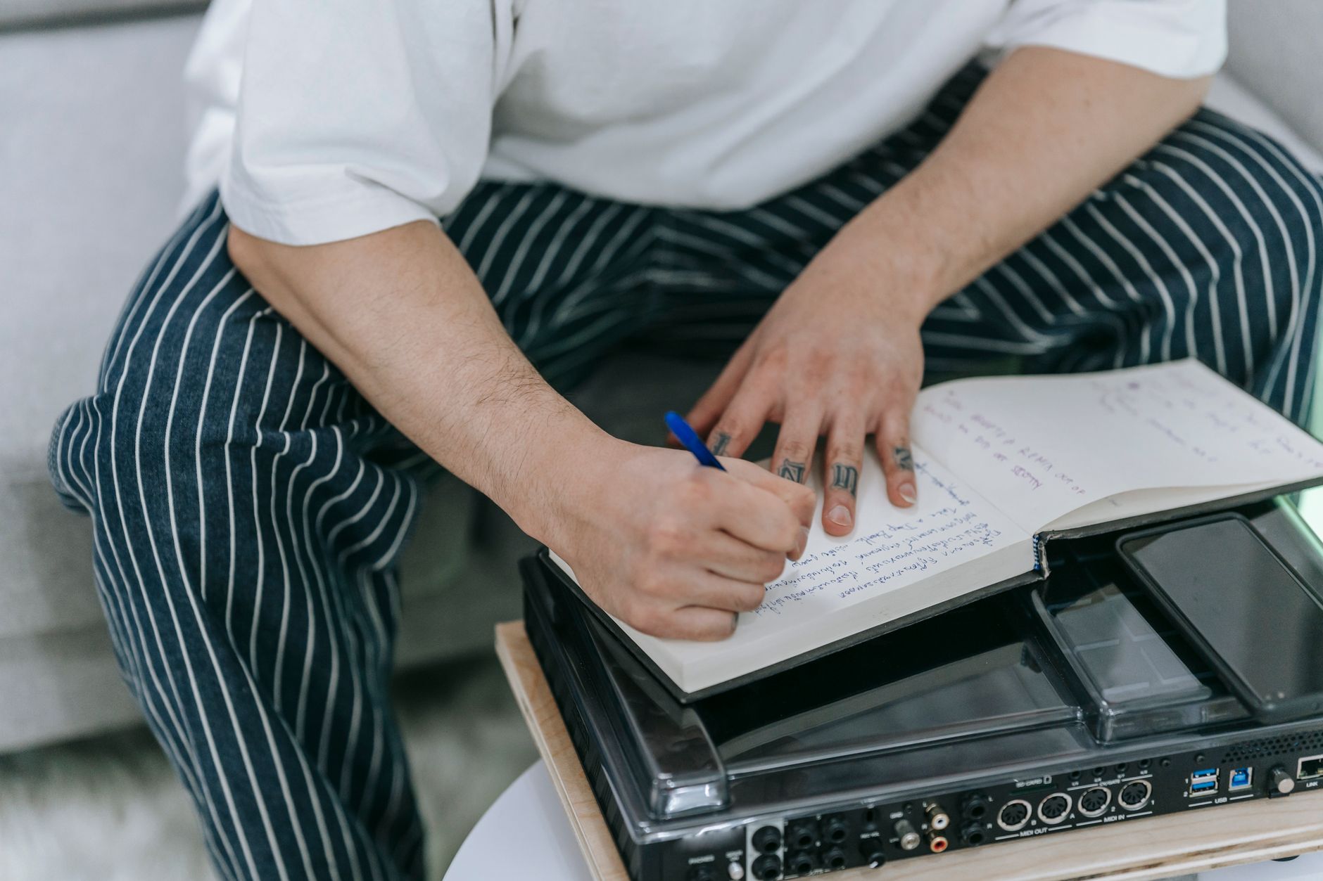 musician notebook composing idea (Photo: Anna Pou / Pexels)