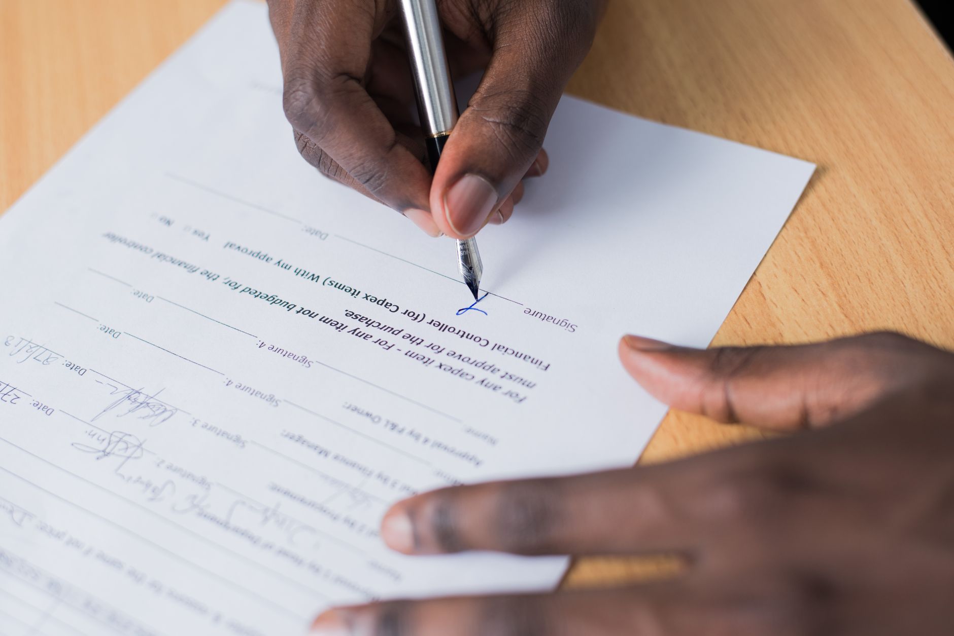 signing contract documents pen (Photo: Cytonn Photography / Pexels)