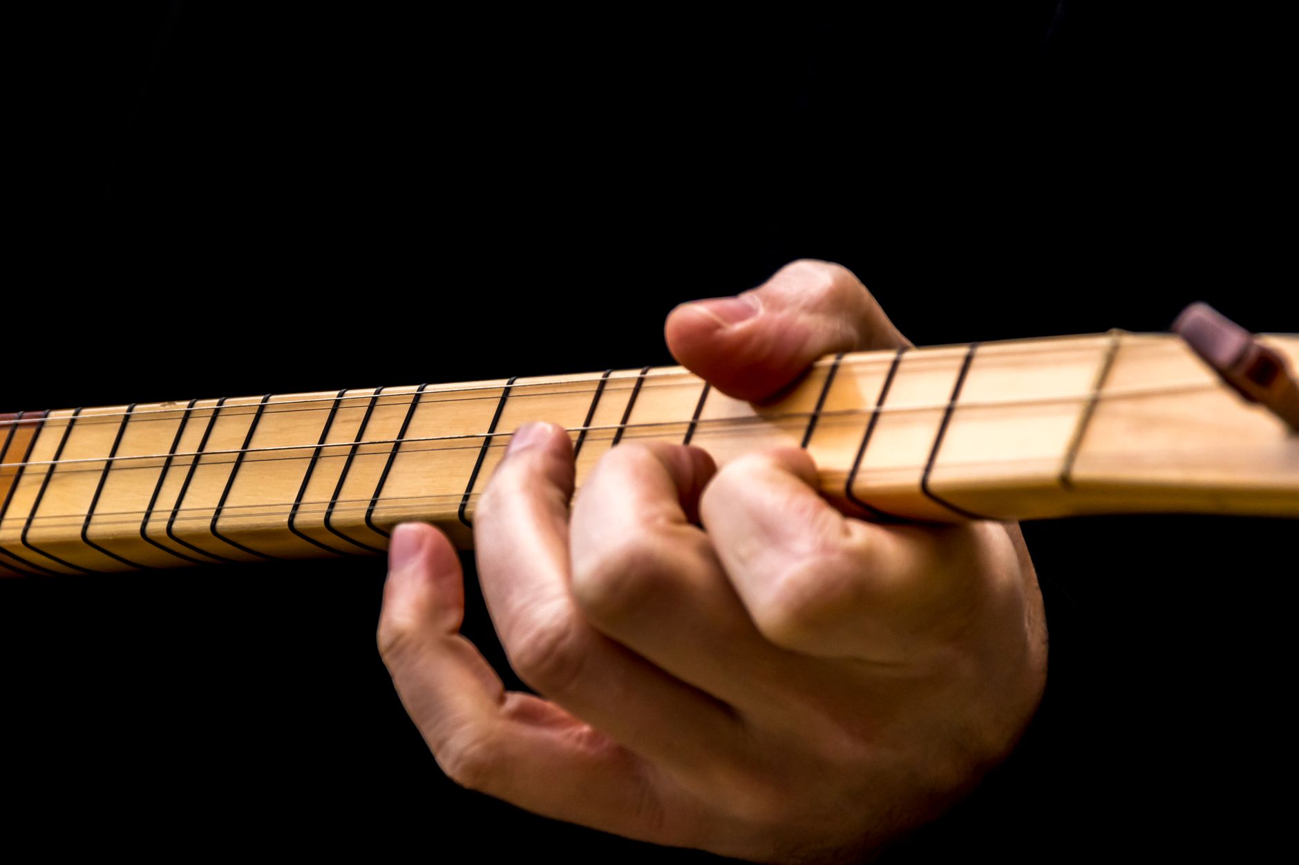 guitar fretboard hand (Photo: Zafer Erdoğan / Pexels)