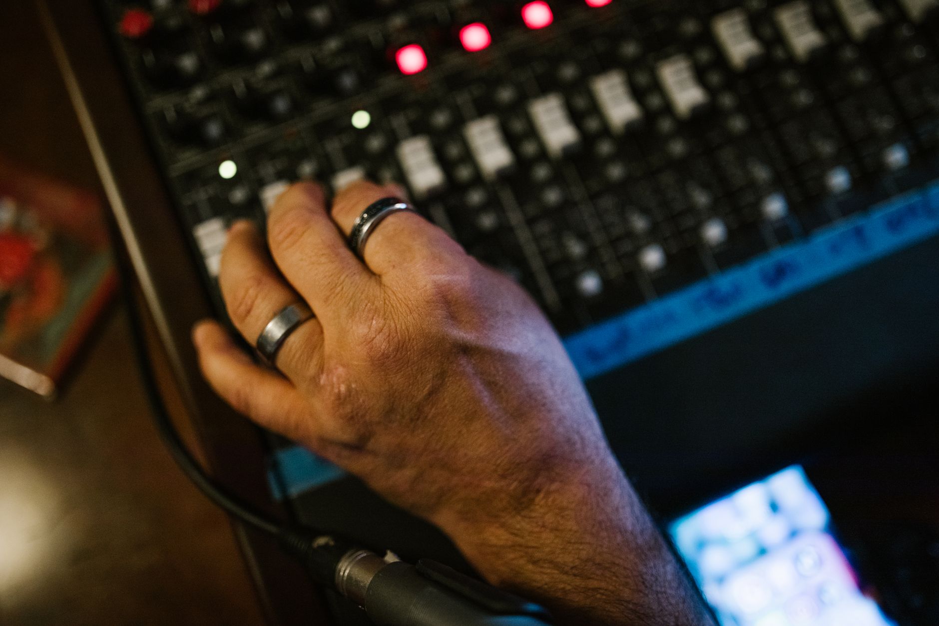 producer adjusting mixer frowning (Photo: RDNE Stock project / Pexels)