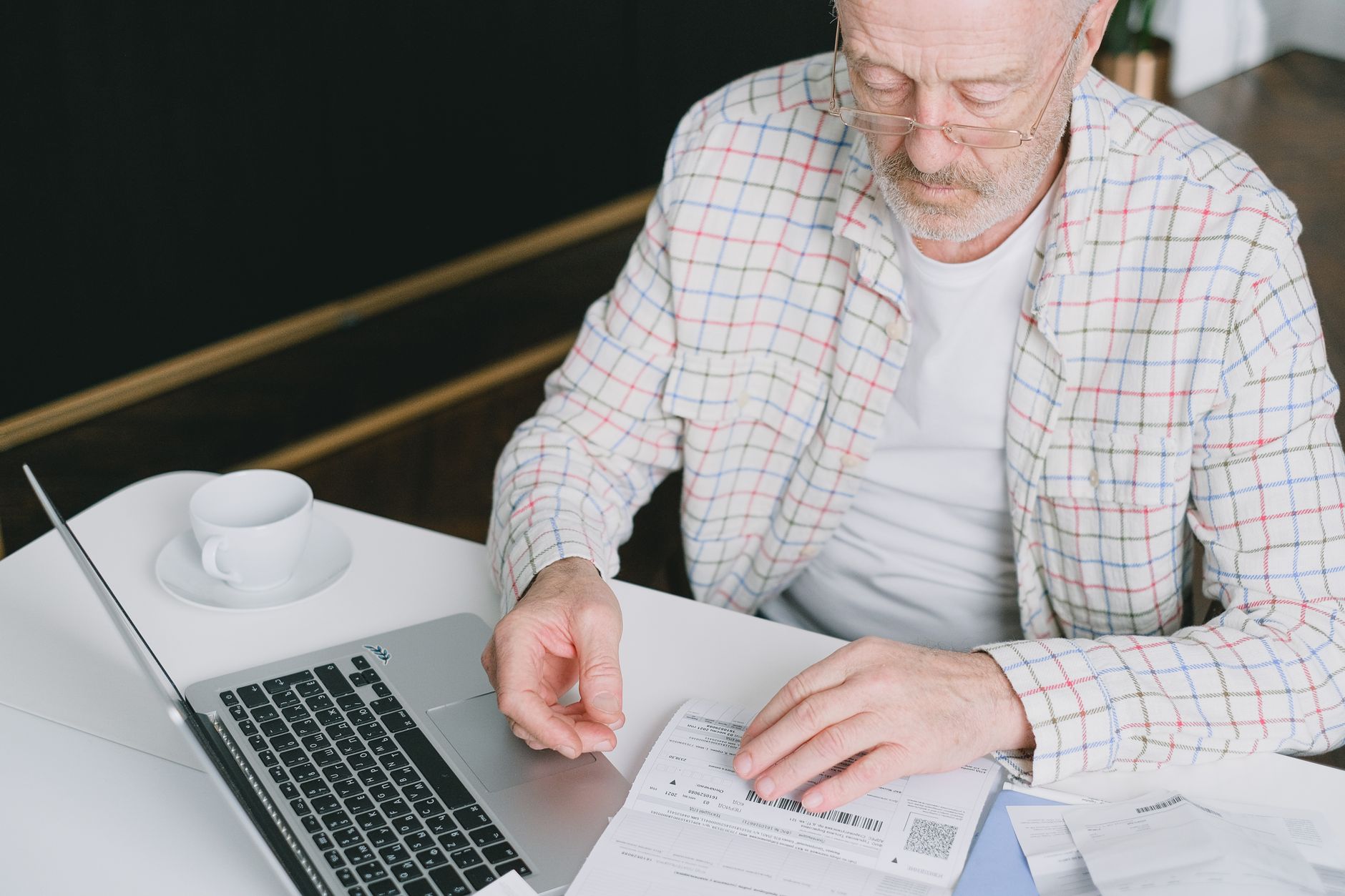 reading document laptop careful (Photo: SHVETS production / Pexels)