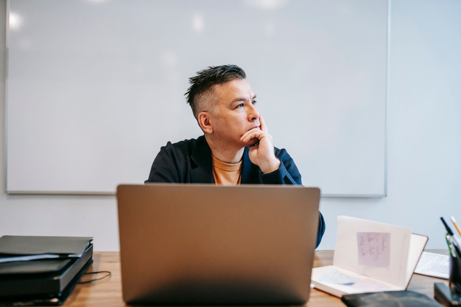 musician thinking at desk (Photo: Vanessa Garcia / Pexels)