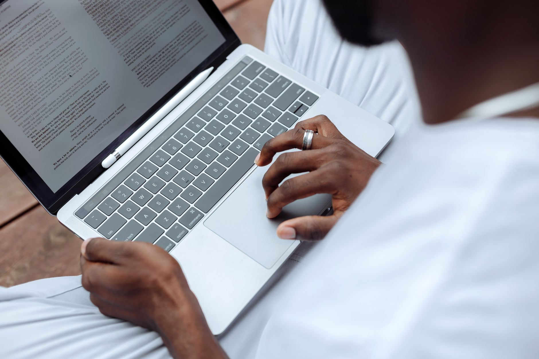 reading terms document laptop (Photo: Thirdman / Pexels)