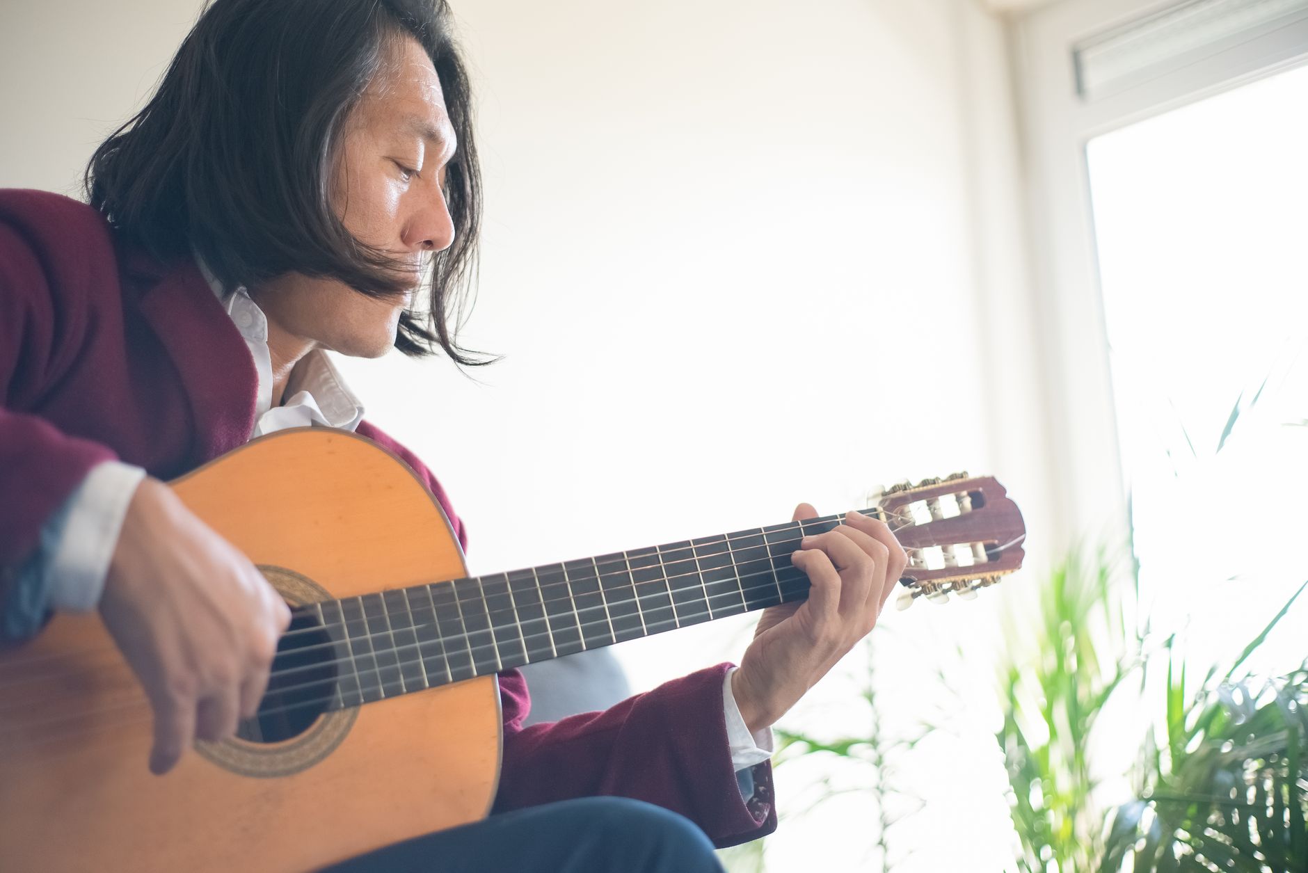 musician practicing home window (Photo: Kampus Production / Pexels)