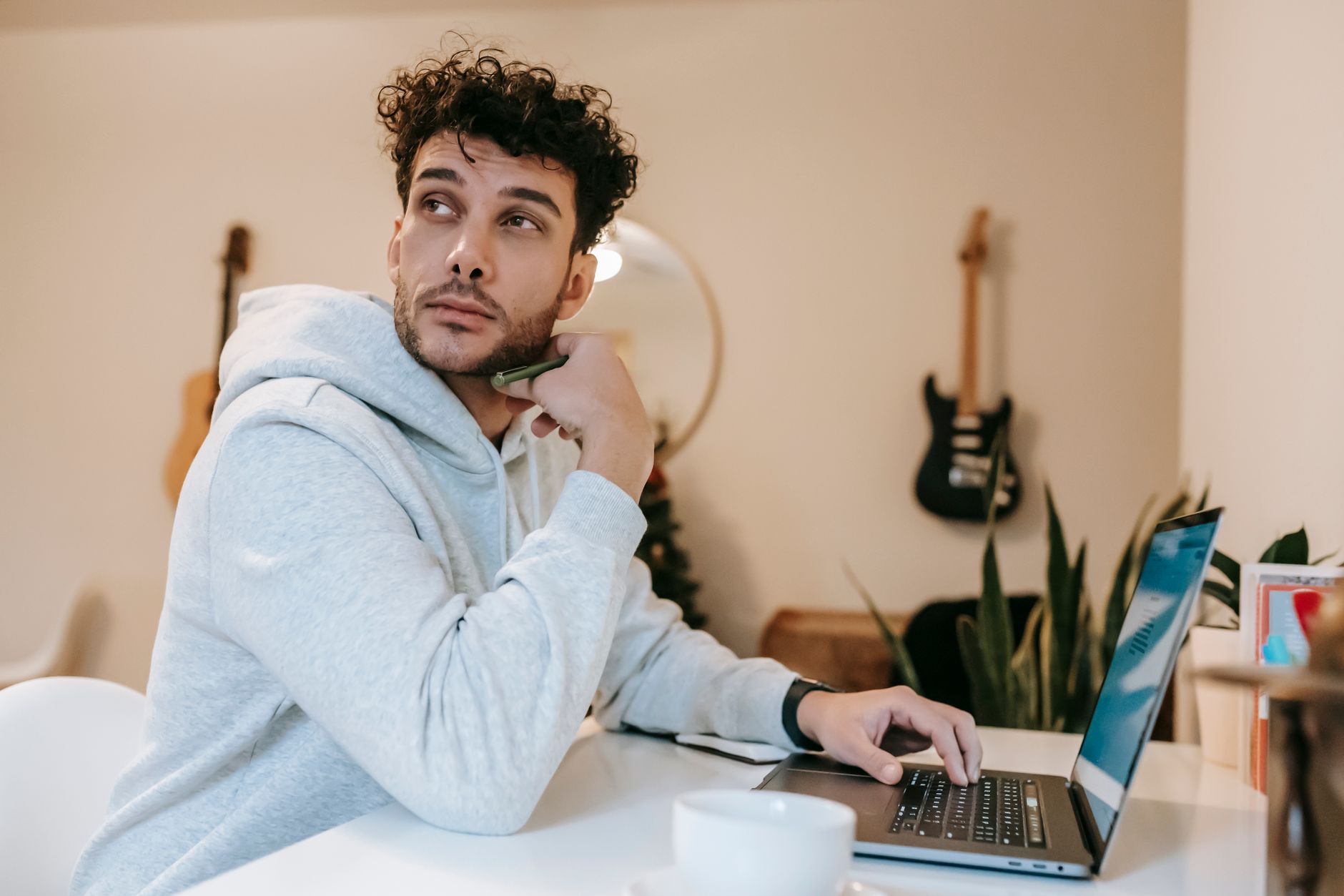 musician thinking at computer (Photo: William  Fortunato / Pexels)