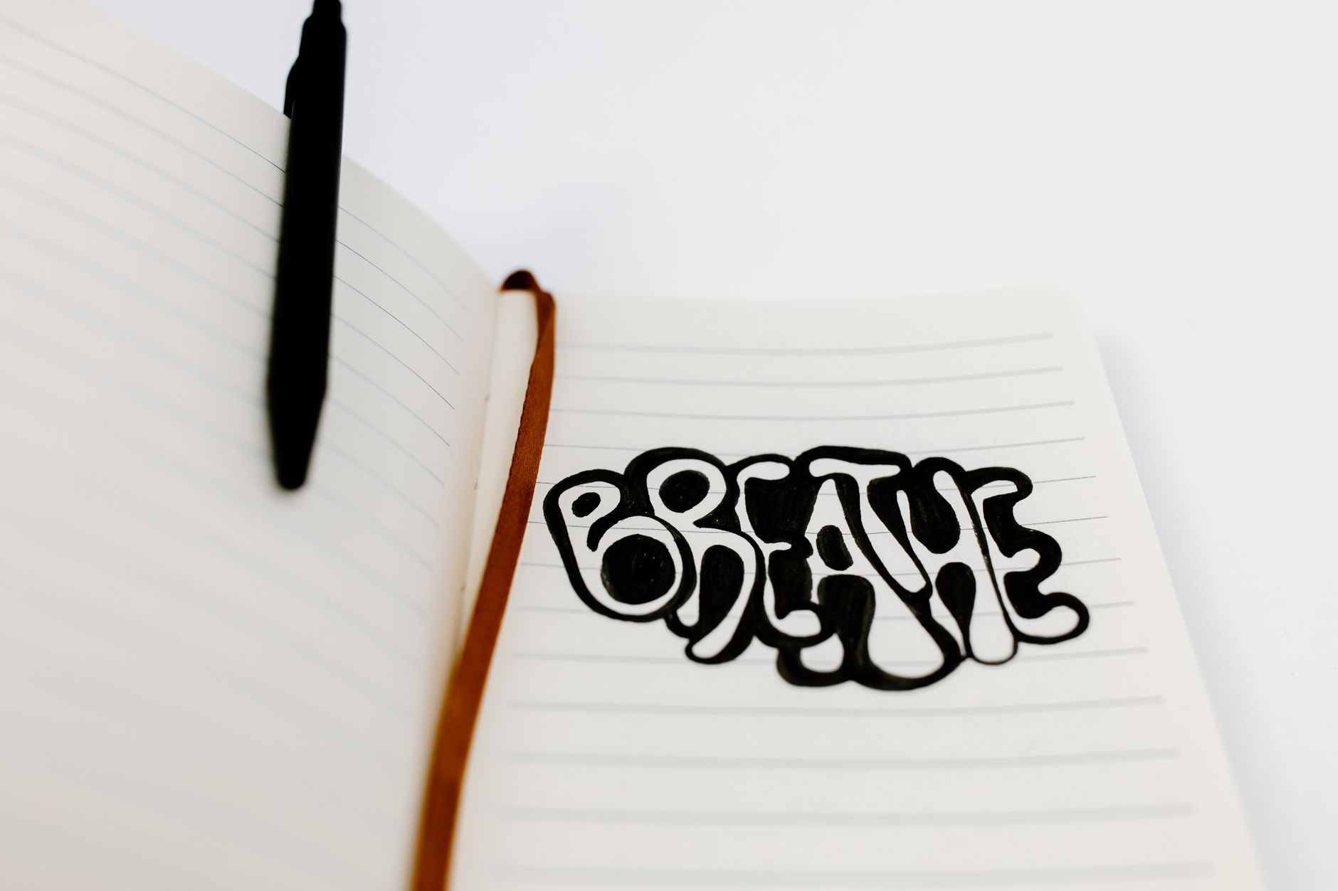 handwritten lyrics notebook pen (Photo: Tara Winstead / Pexels)