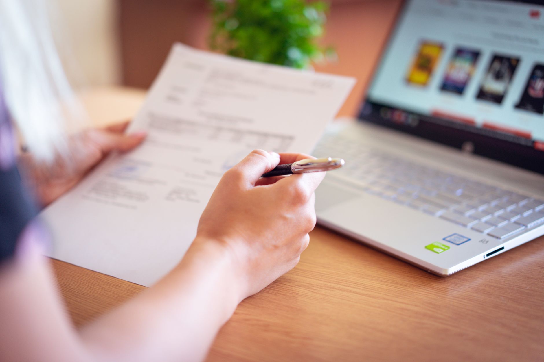 person signing up laptop (Photo: Atlantic Ambience / Pexels)