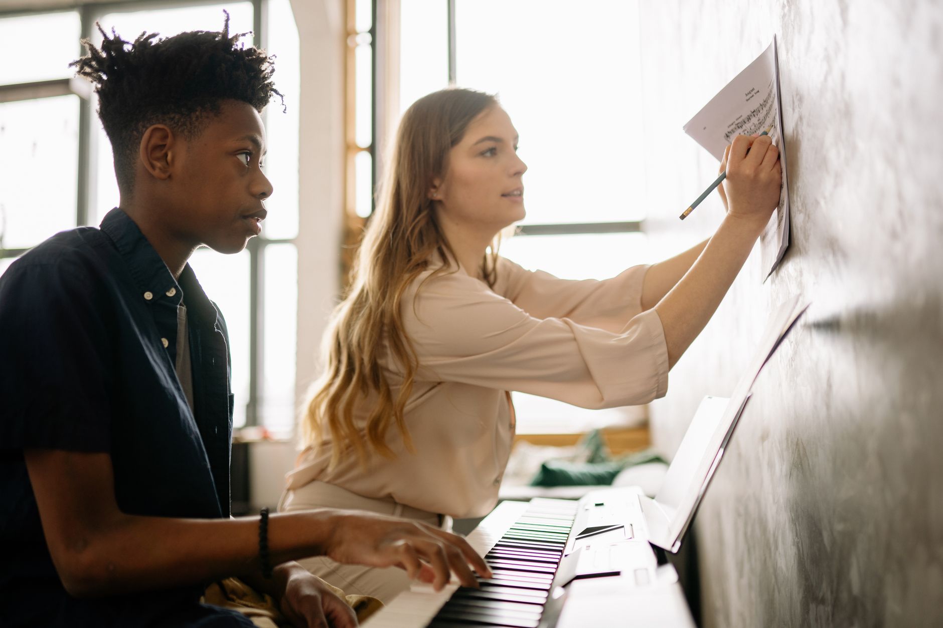 hands writing music notes (Photo: Yan Krukau / Pexels)