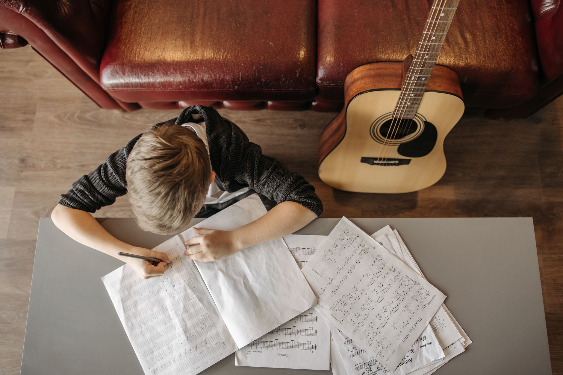 signing document acoustic guitar (Photo: Pavel Danilyuk / Pexels)