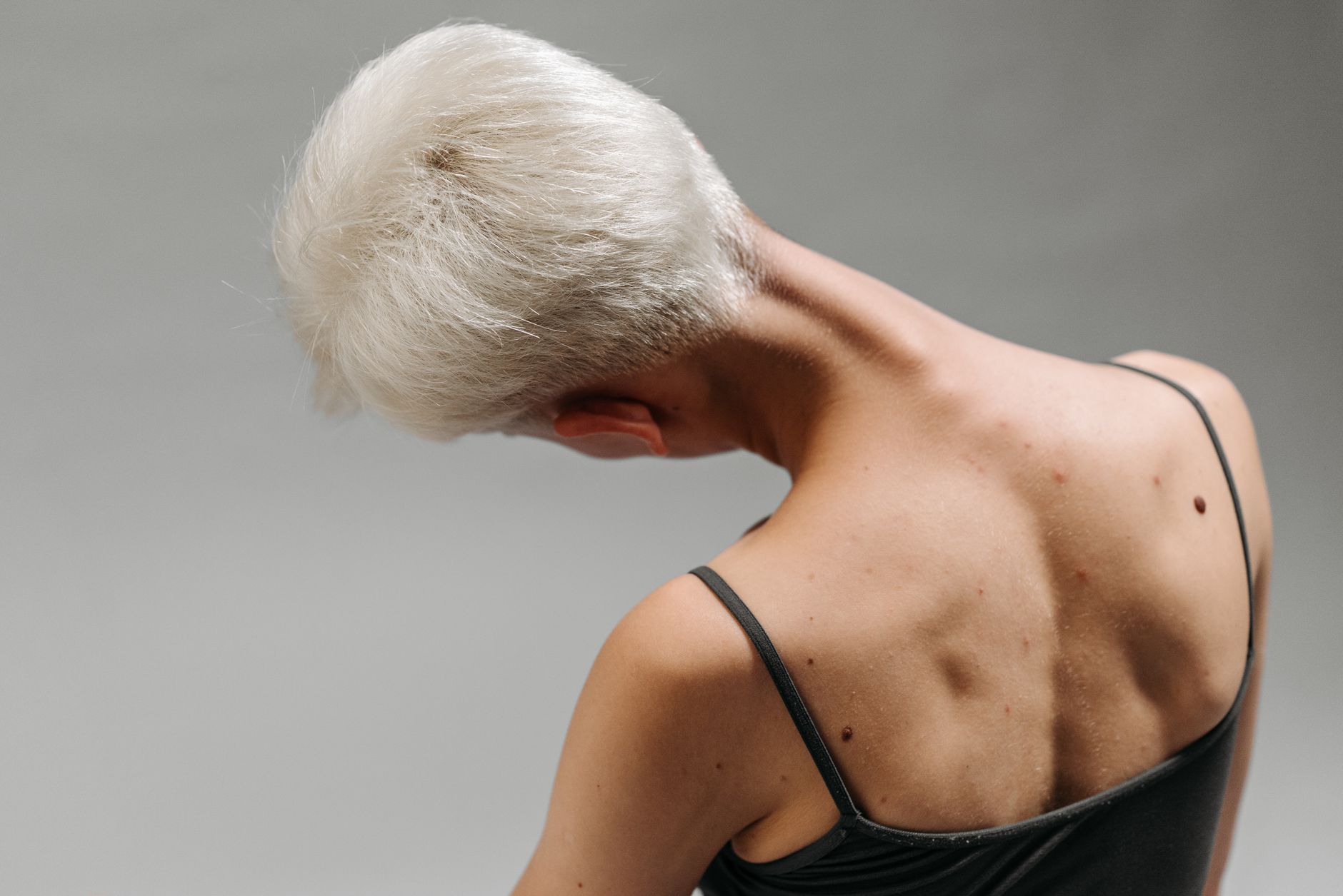 woman stretching shoulders neck (Photo: ROCKETMANN TEAM / Pexels)
