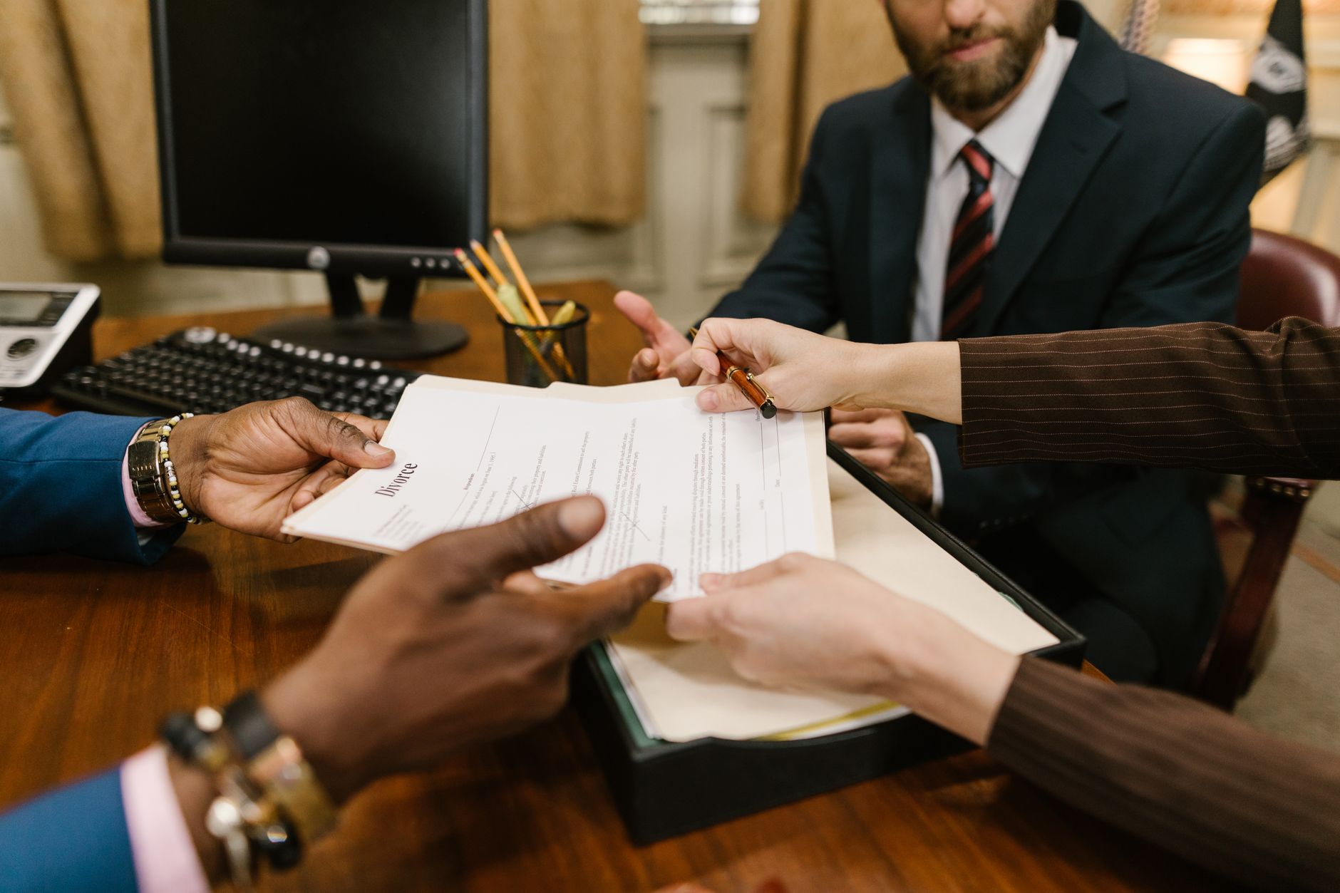handshake contract paper desk (Photo: RDNE Stock project / Pexels)