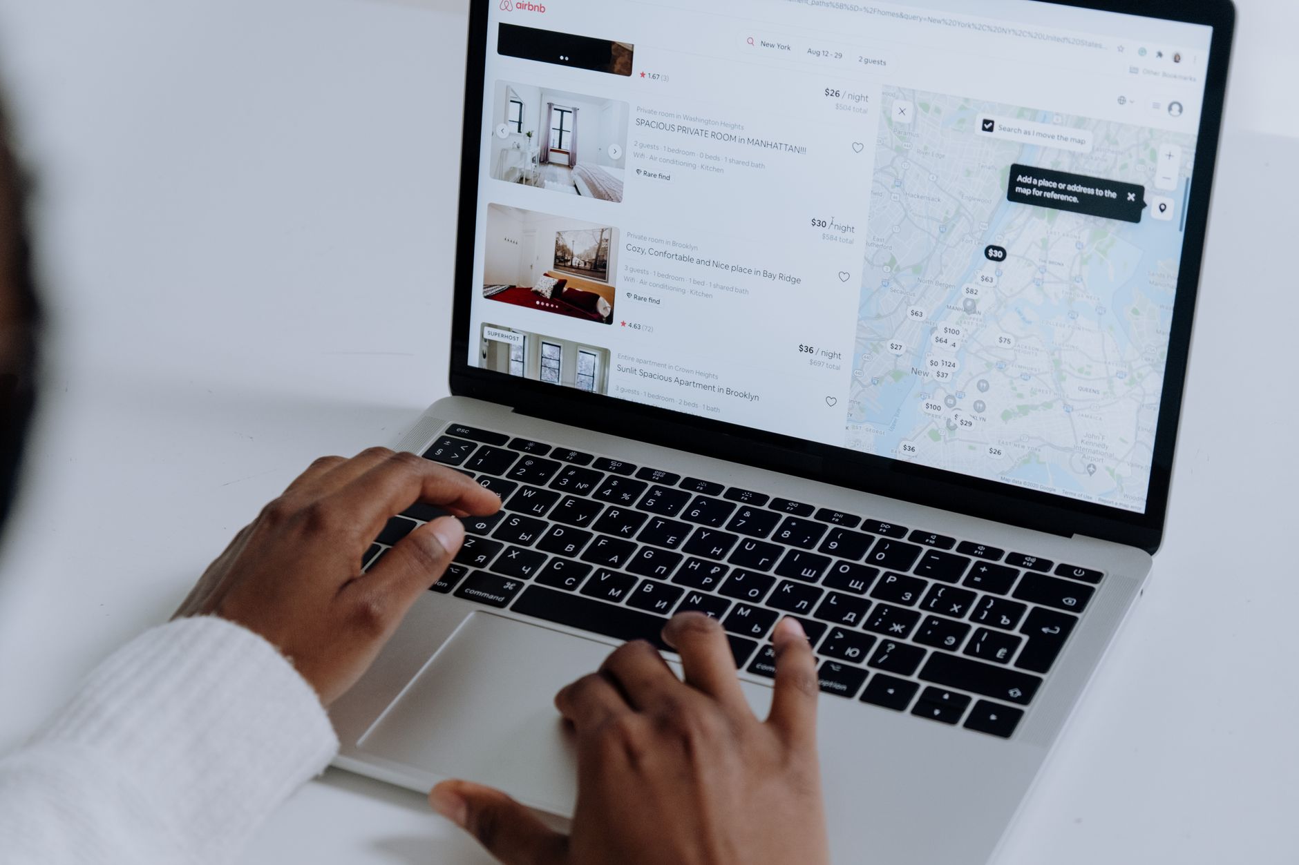 person searching laptop database (Photo: cottonbro studio / Pexels)