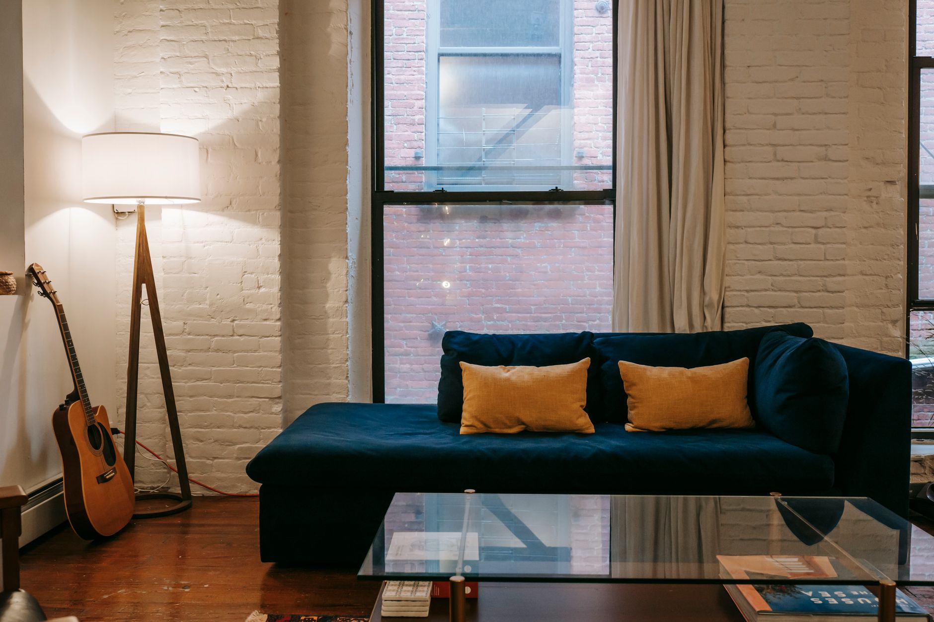 guitar case room window (Photo: Charlotte May / Pexels)