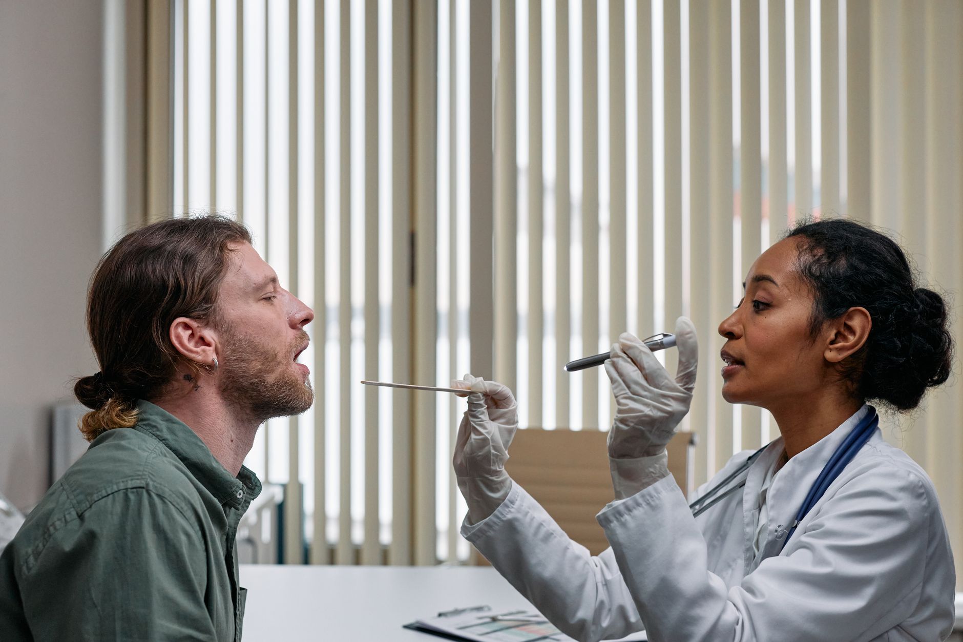 doctor examining patient throat (Photo: cottonbro studio / Pexels)