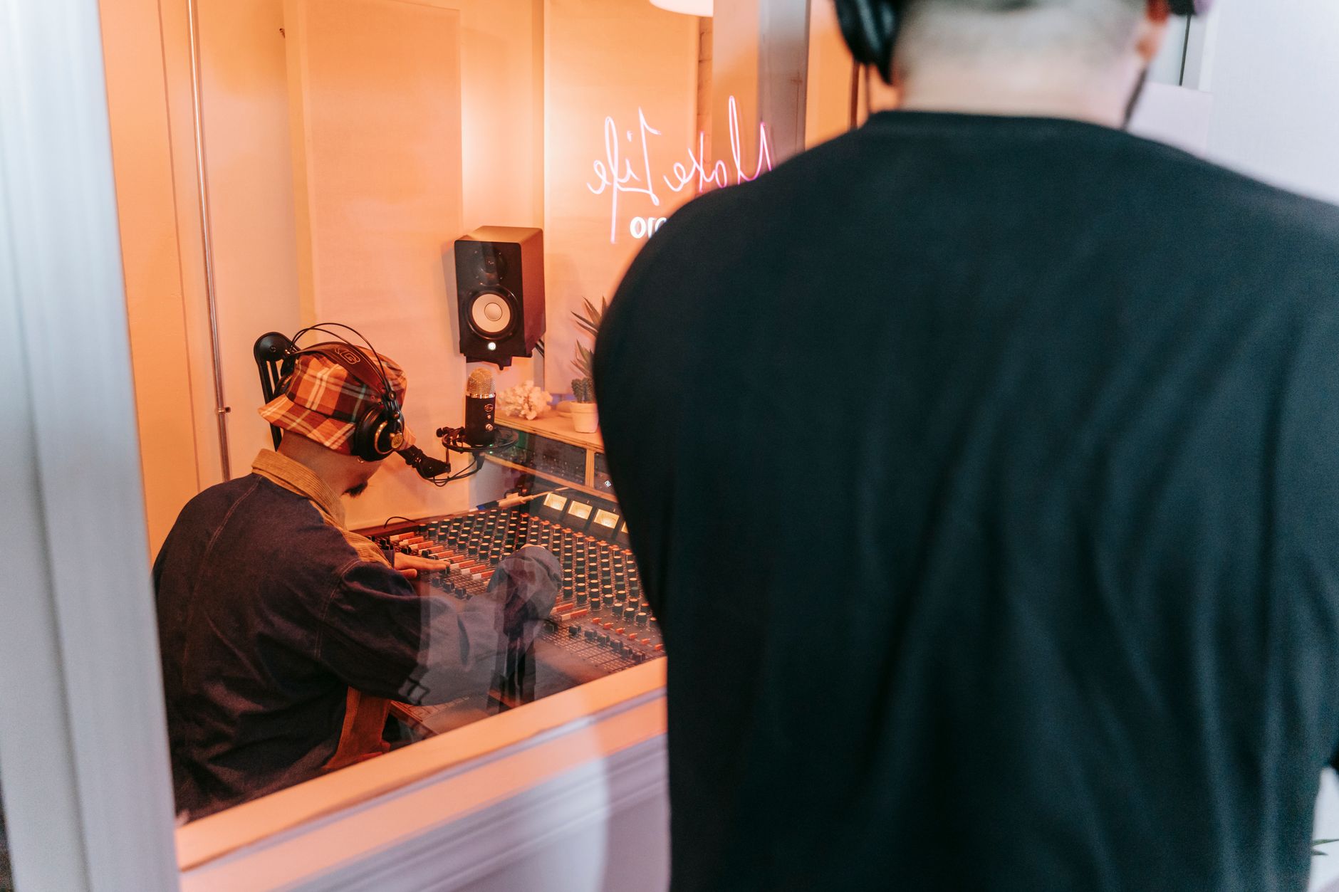 musician headphones sunset window (Photo: Anna Pou / Pexels)