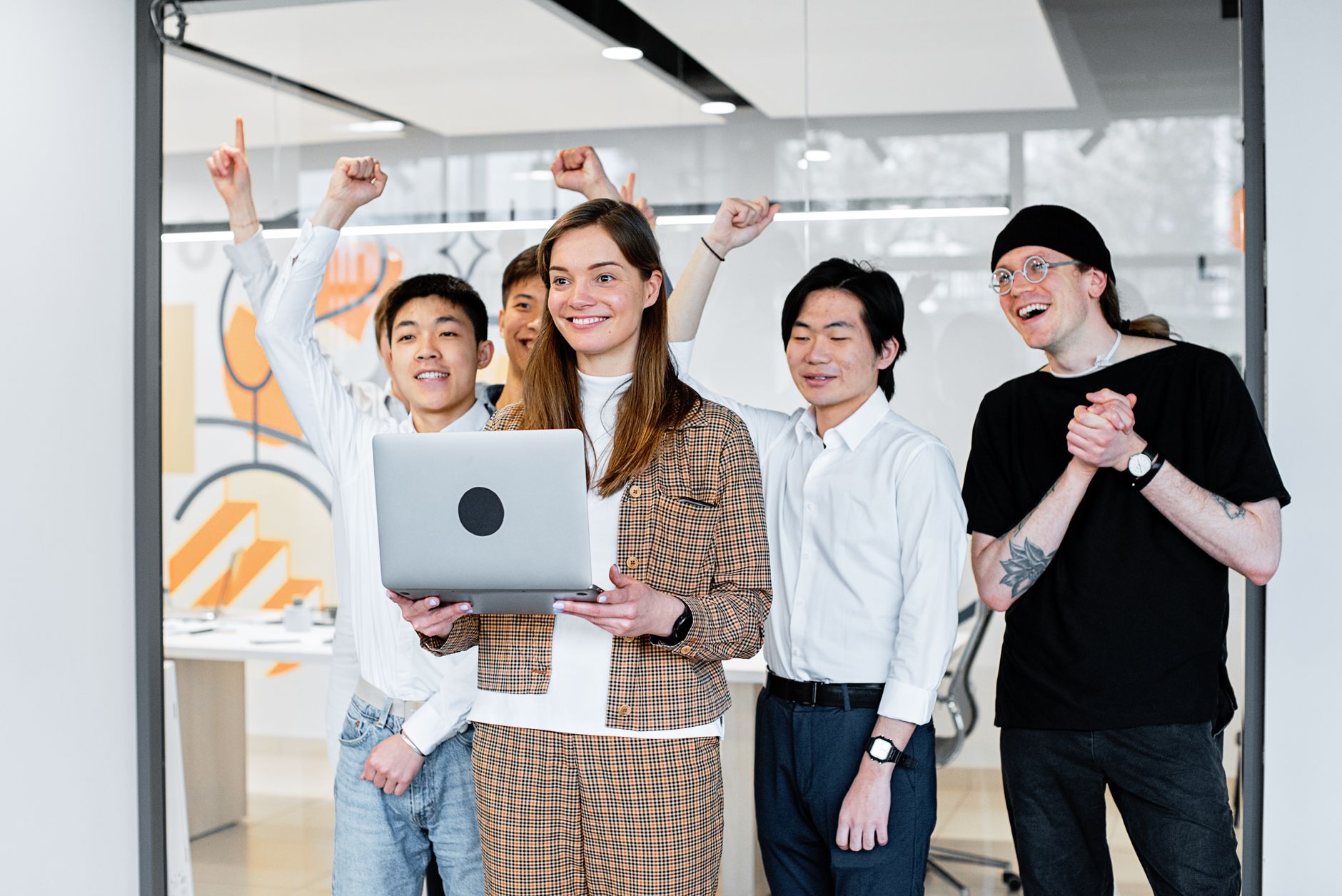 celebrating success laptop (Photo: Mikhail Nilov / Pexels)
