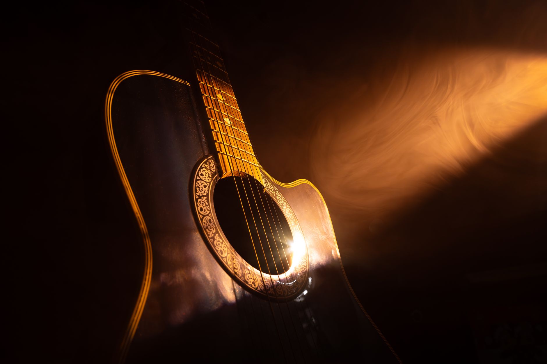 acoustic guitar warm stage light (Photo: Karl  Byron / Pexels)