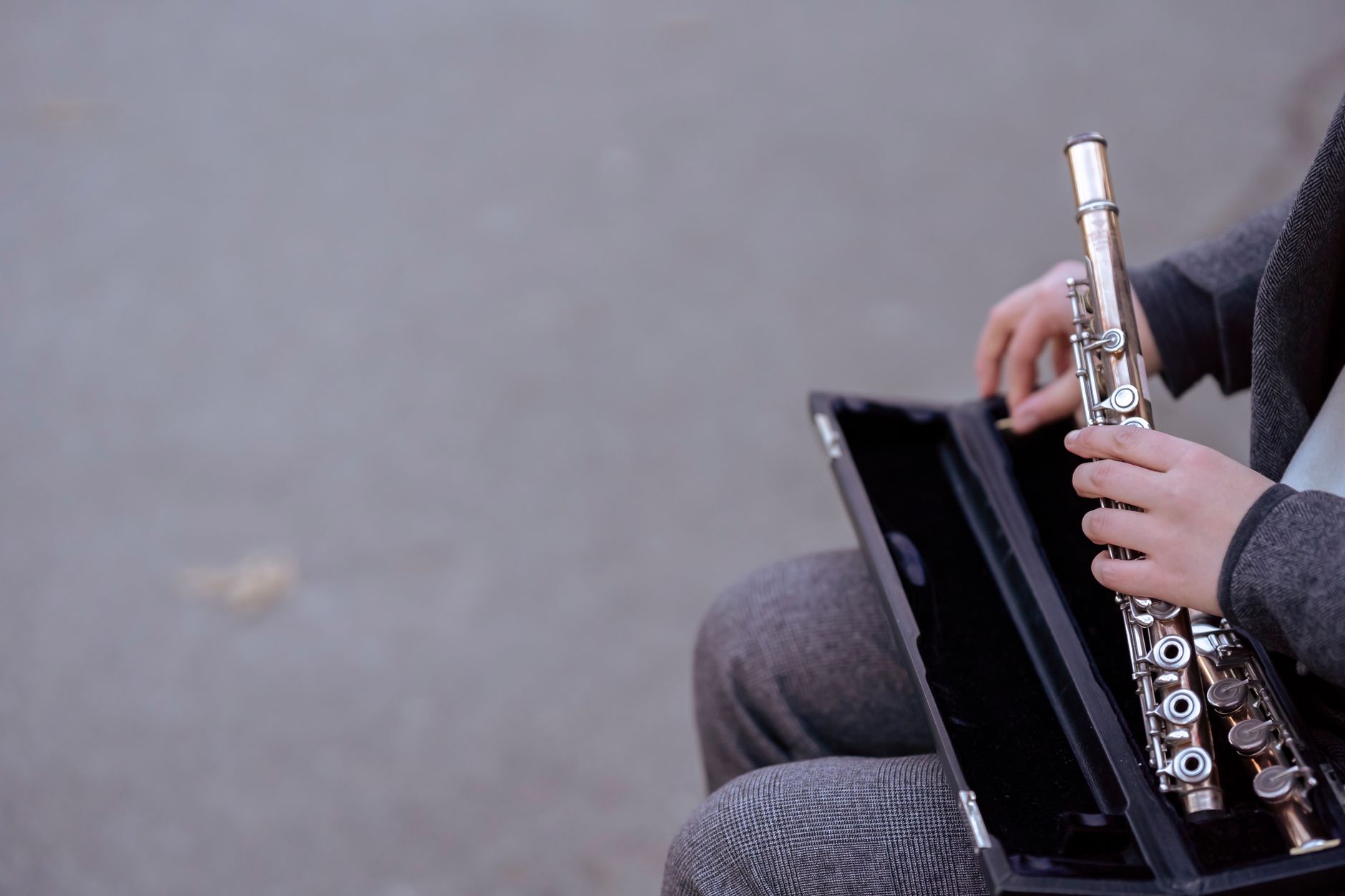 musician carrying instrument case (Photo: Charles Parker / Pexels)