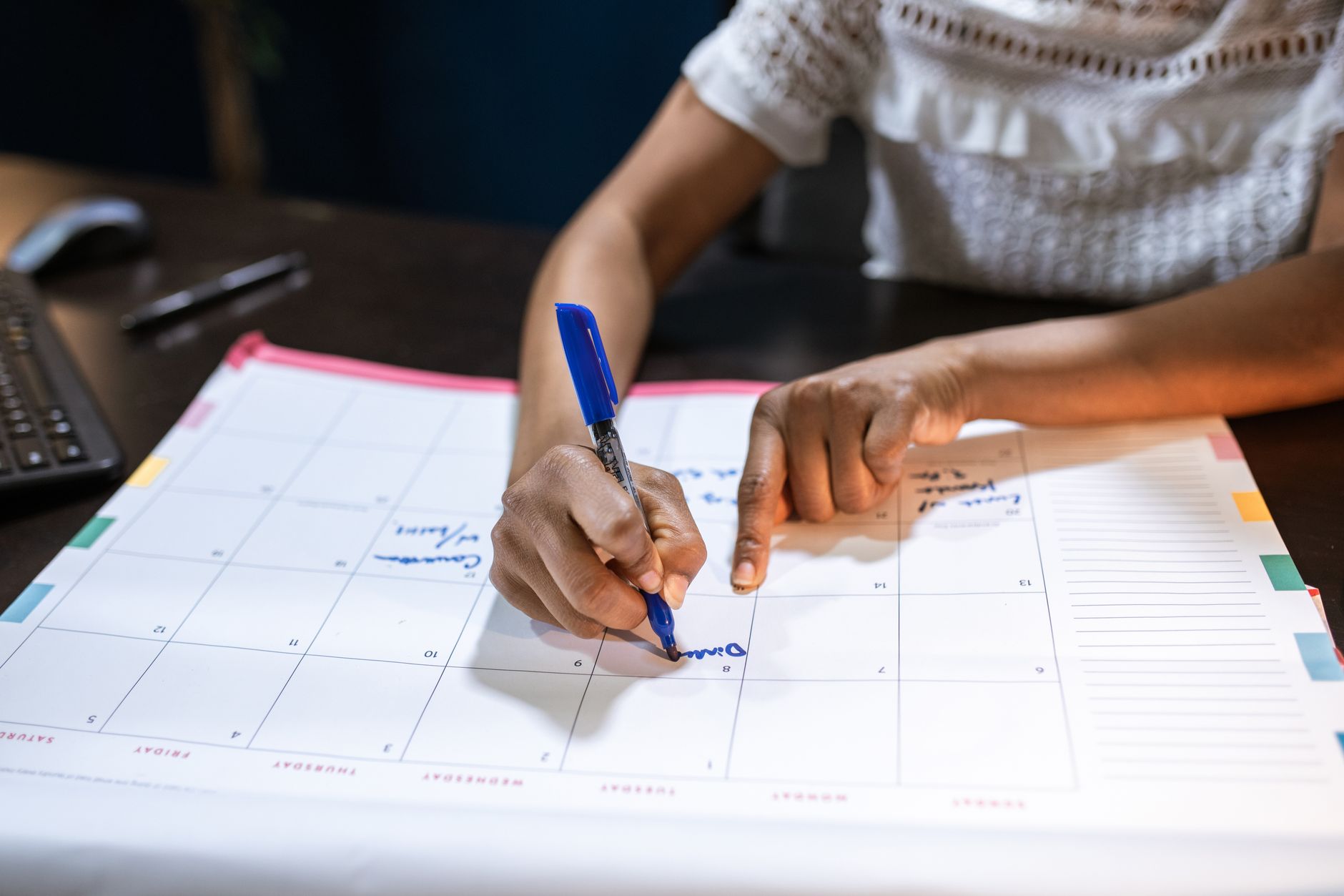 event planner writing notes (Photo: RDNE Stock project / Pexels)