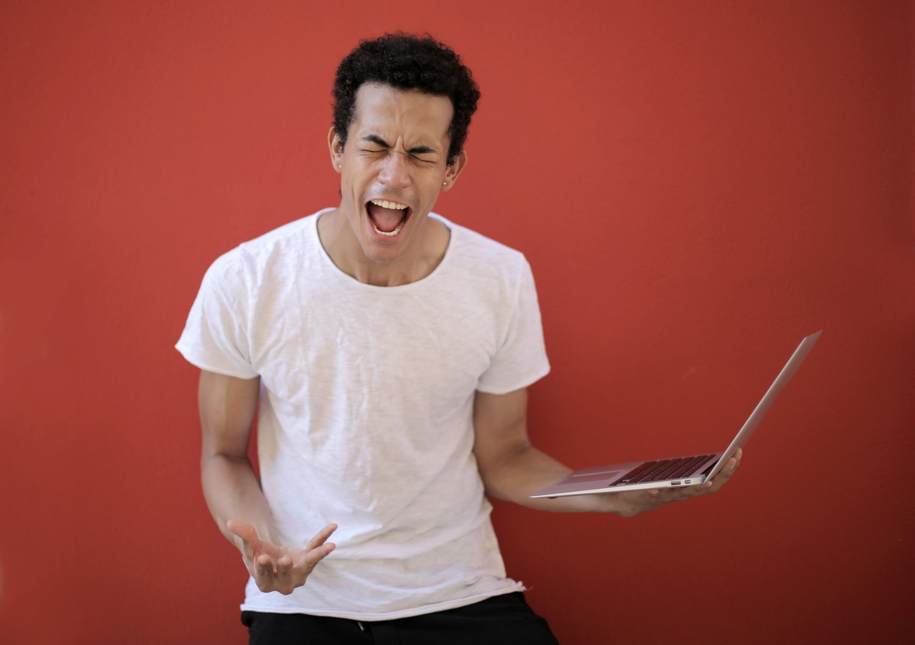 frustrated musician laptop studio (Photo: Andrea Piacquadio / Pexels)