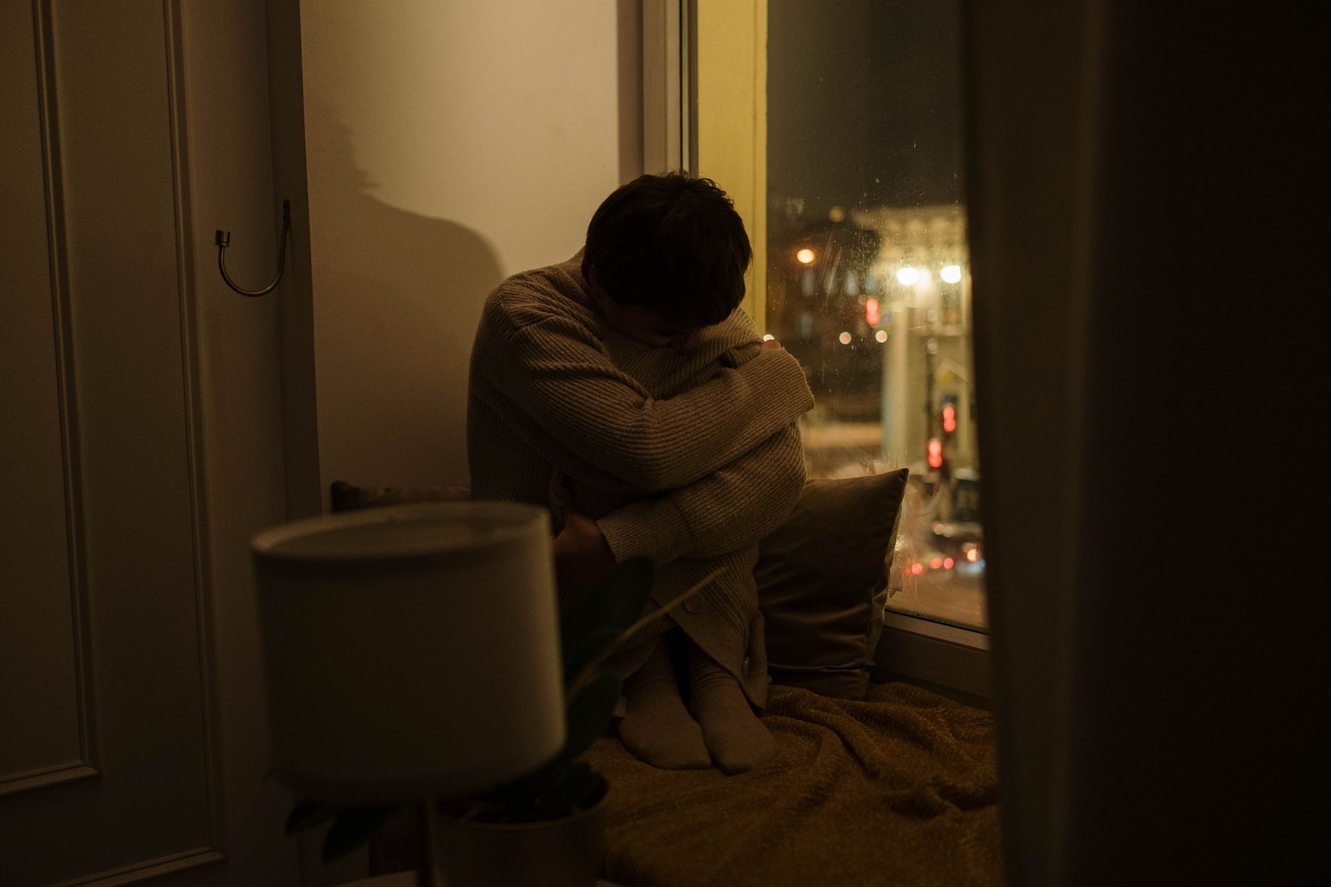 person sitting quiet window thoughtful (Photo: cottonbro studio / Pexels)