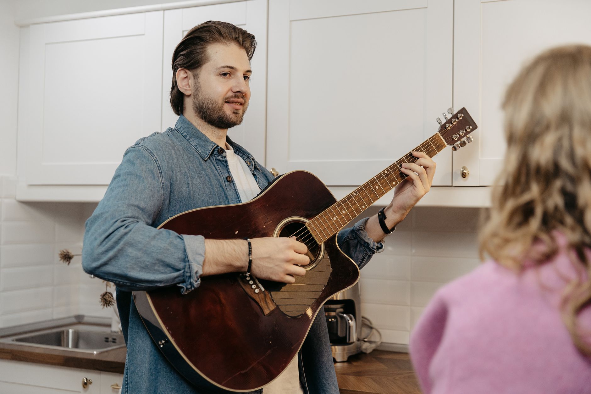 adult man acoustic guitar (Photo: SHVETS production / Pexels)