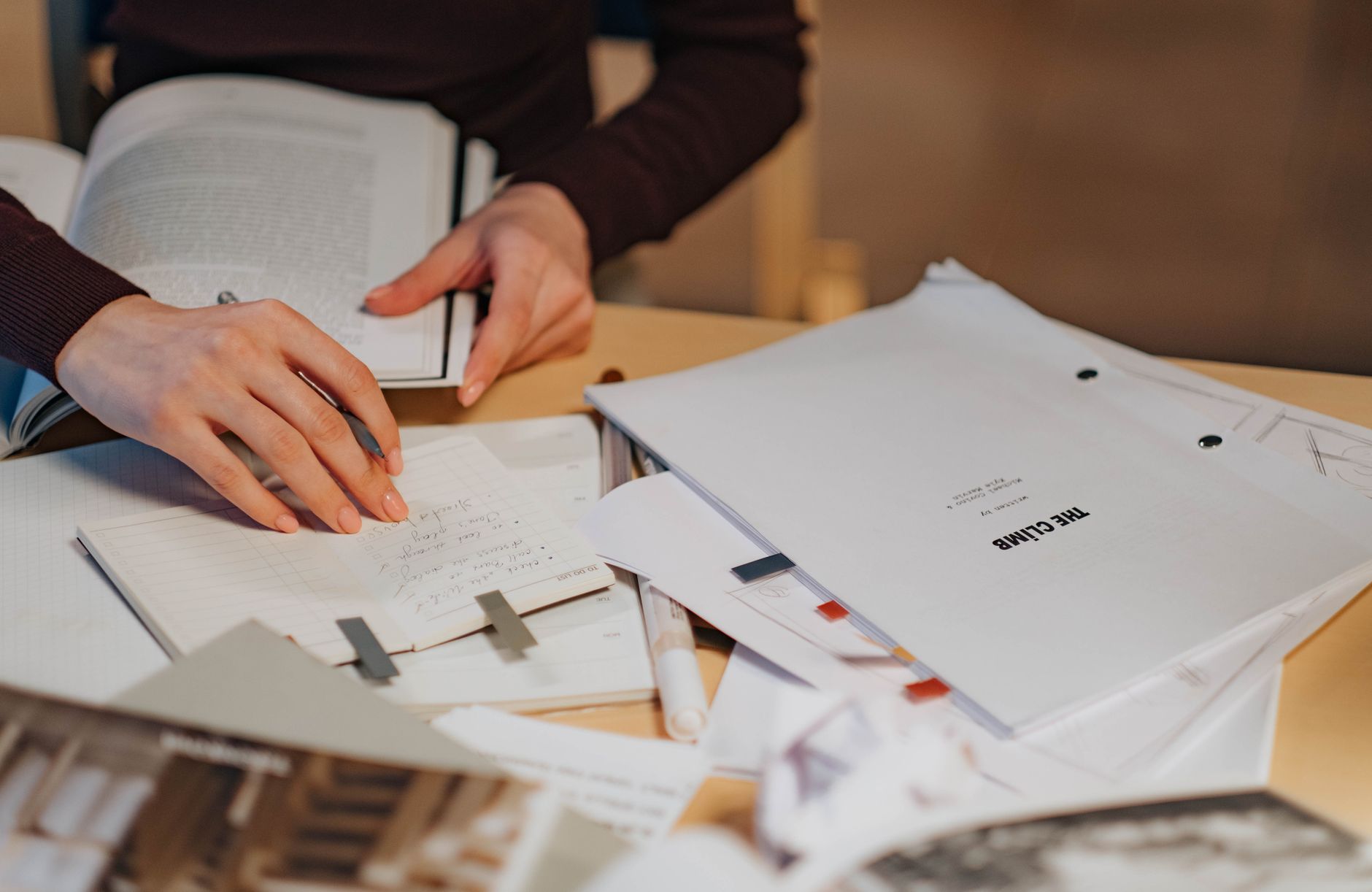 musician writing notebook desk (Photo: Ron Lach / Pexels)