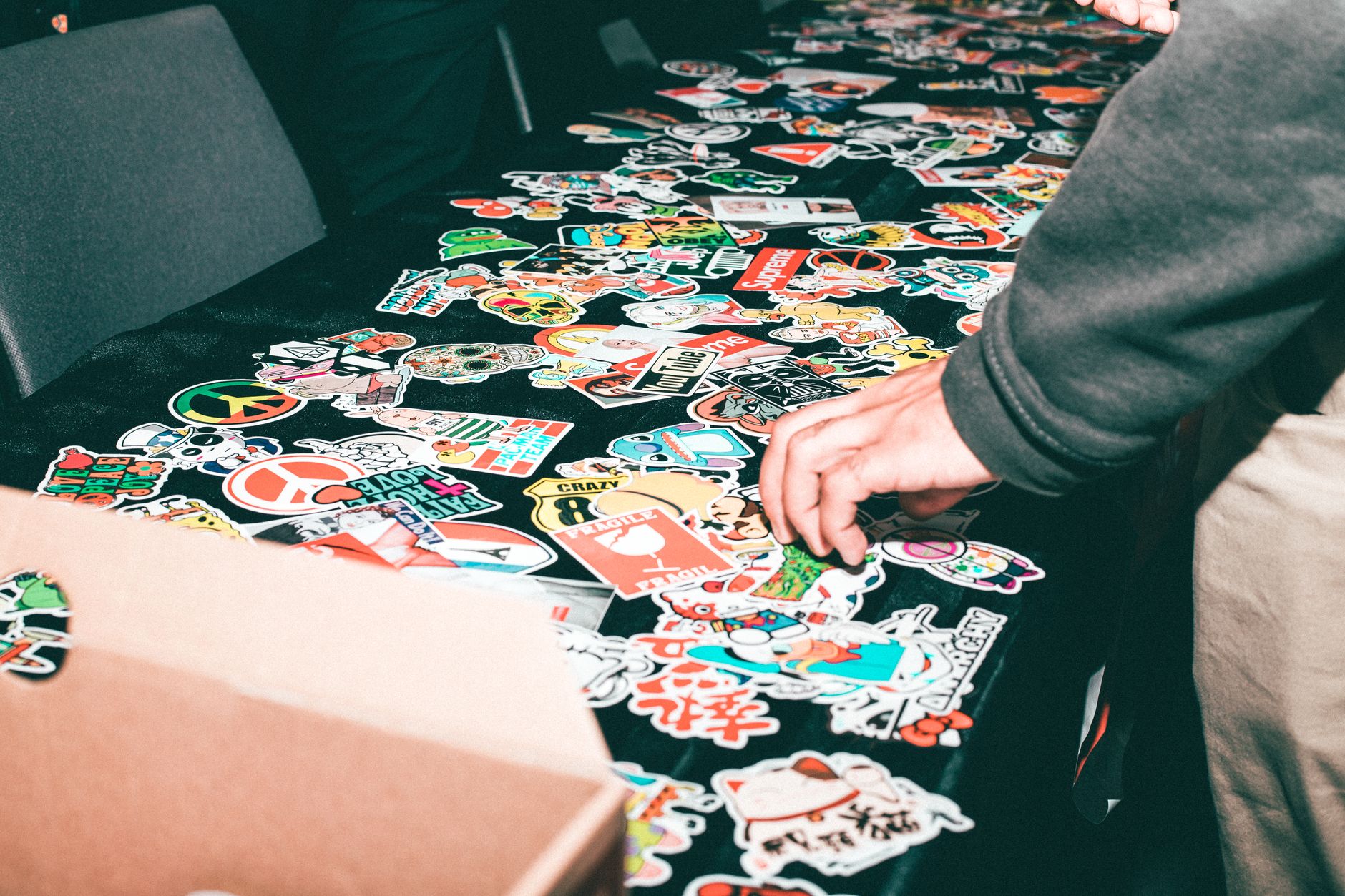 merch table band stickers (Photo: Javon Swaby / Pexels)