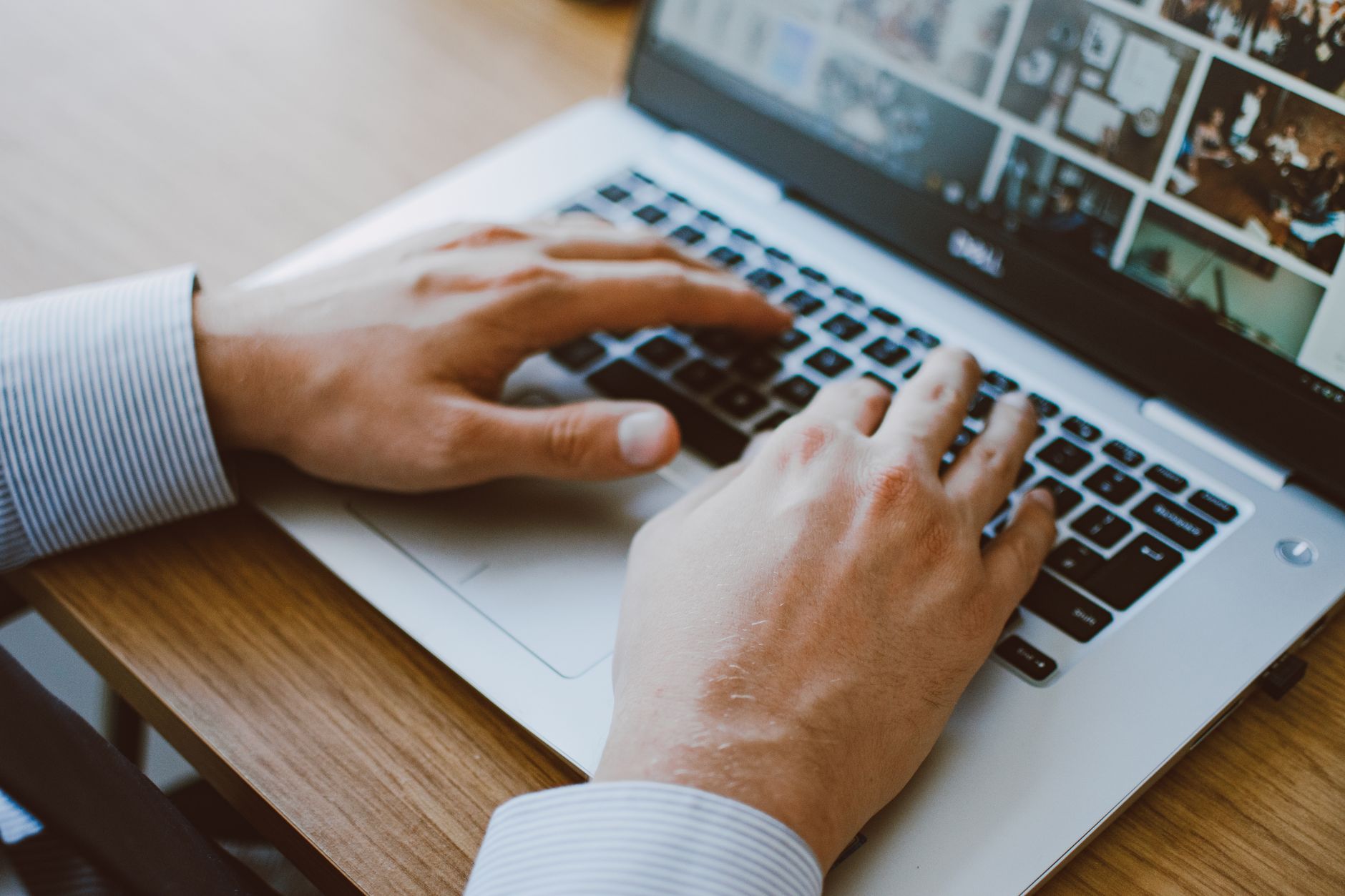 person setting up laptop (Photo: Lisa Fotios / Pexels)